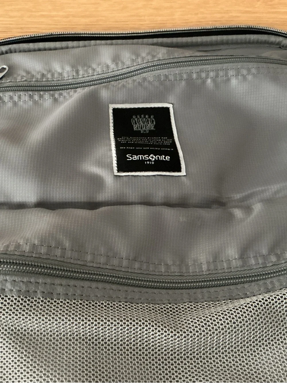 Samsonite Optimum softside spinner carry-on suitcase.